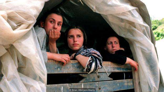 Three Kosovar girls escaping from Kosovo into Albania near Kukes.